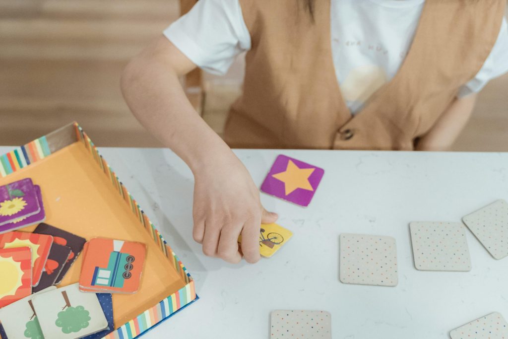 children playing memory card matching game